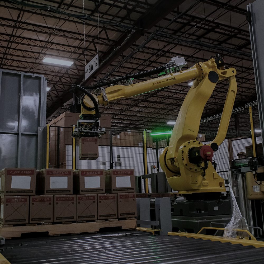 Industrial palletizing arm working a production line